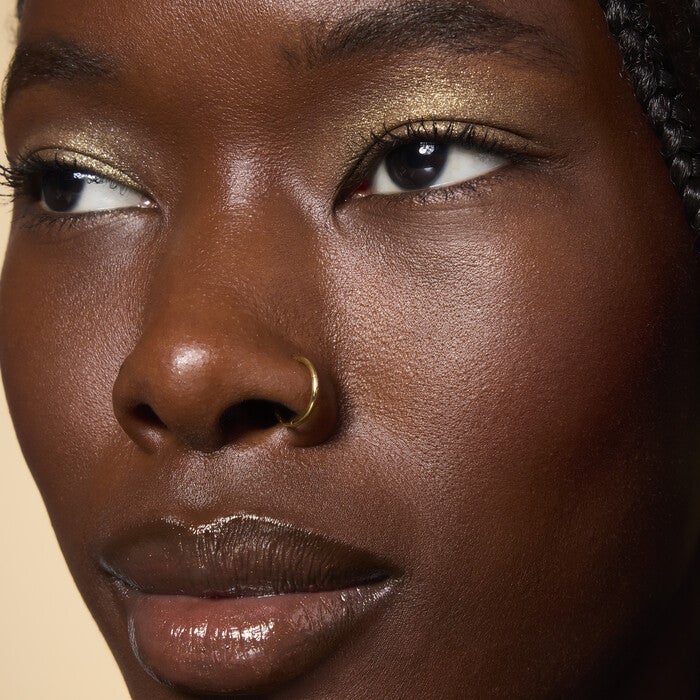 Model Wearing It's Gilt Gold Glitter Eyeshadow
